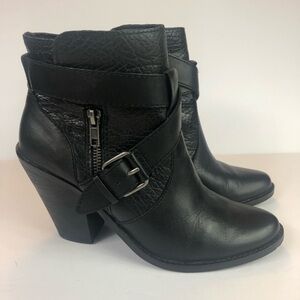 DV black booties wrap around strap with buckle.
